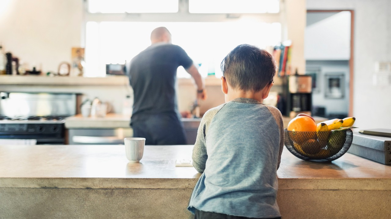 Rear view of father and son in kitchen; image used for HSBC Home loans.