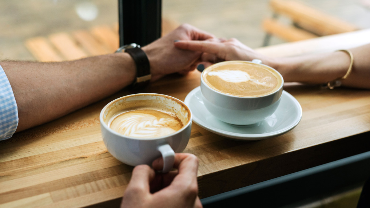 Holding hands with two latte arts; image used for HSBC Australia retrieve your additional cardholder application
