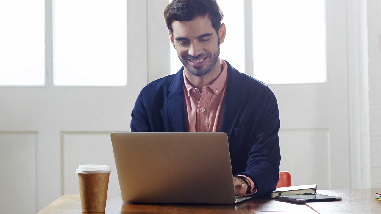 A man working from home in an apartment; image used in HSBC Australia form page.