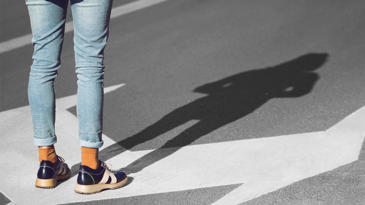 A person standing on road; image used for HSBC Australia compare saving accounts.