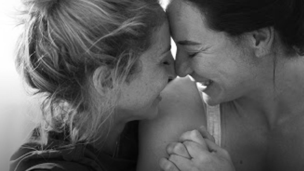 Women hugging and touching foreheads; image used for HSBC Join the bigger picture.