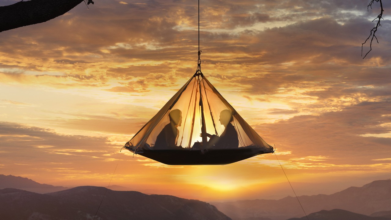 Sitting in a tent during sunset; image used for HSBC Premier Card page.
