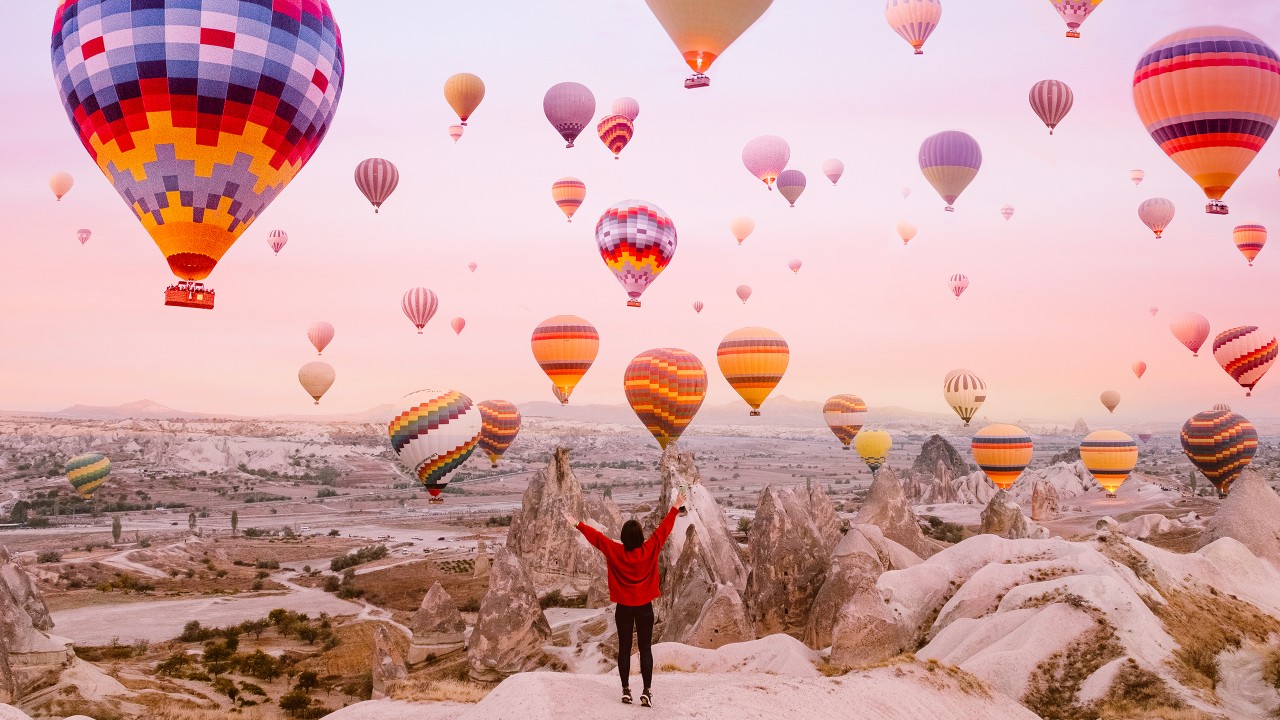 A woman on a background of flying balloons; image used for HSBC Interest free offer page