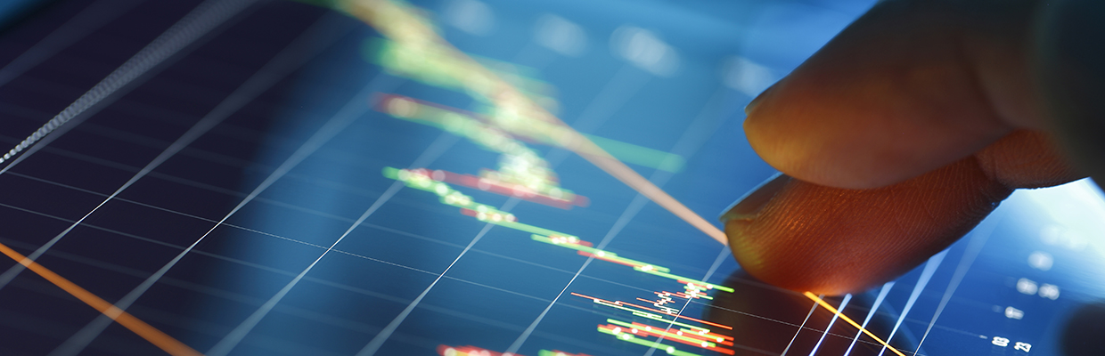 Two fingers are on a real time rate monitor to check the foreign exchange rate; image used for HSBC FX Order Watch.