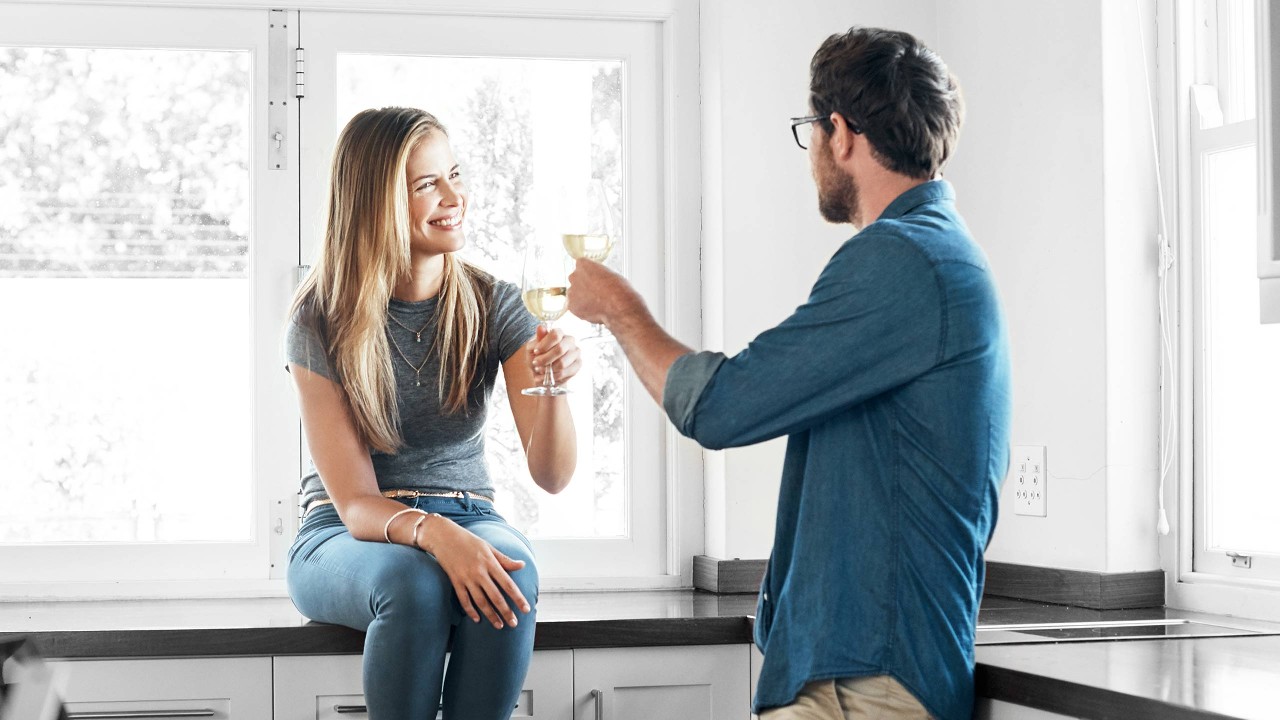 A couple drinking wine together; image used for HSBC Australia so you're thinking of buying a home