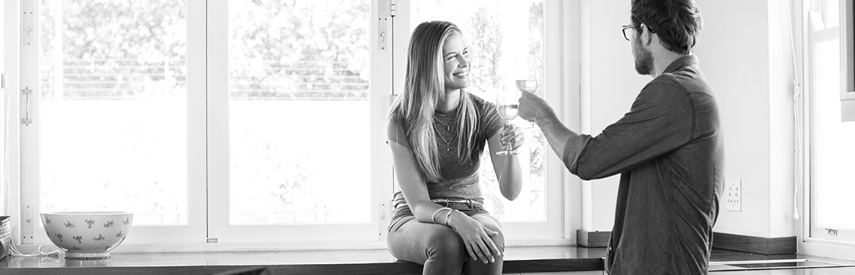 A couple drinking wine together; image used for HSBC Australia everything you need to know about solicitors, conveyancing and property searches