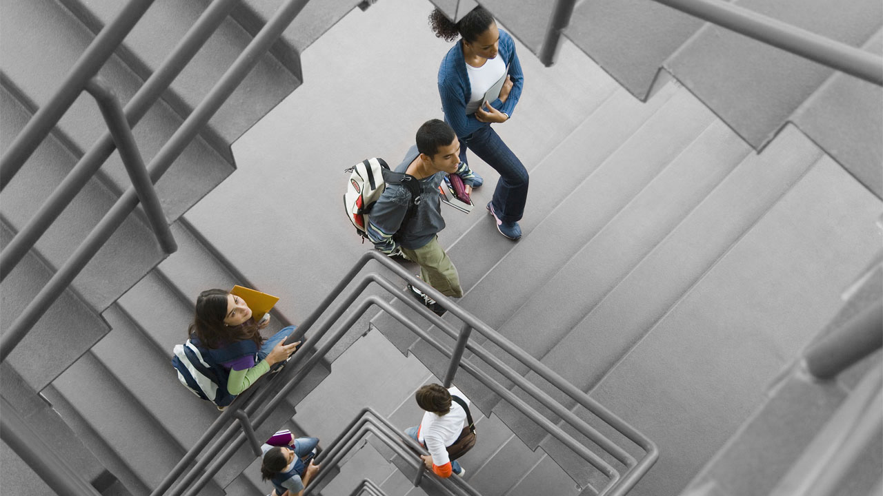 A group of students walking up staircase; image used for HSBC Australia New grads: avoid this common financial mistake.